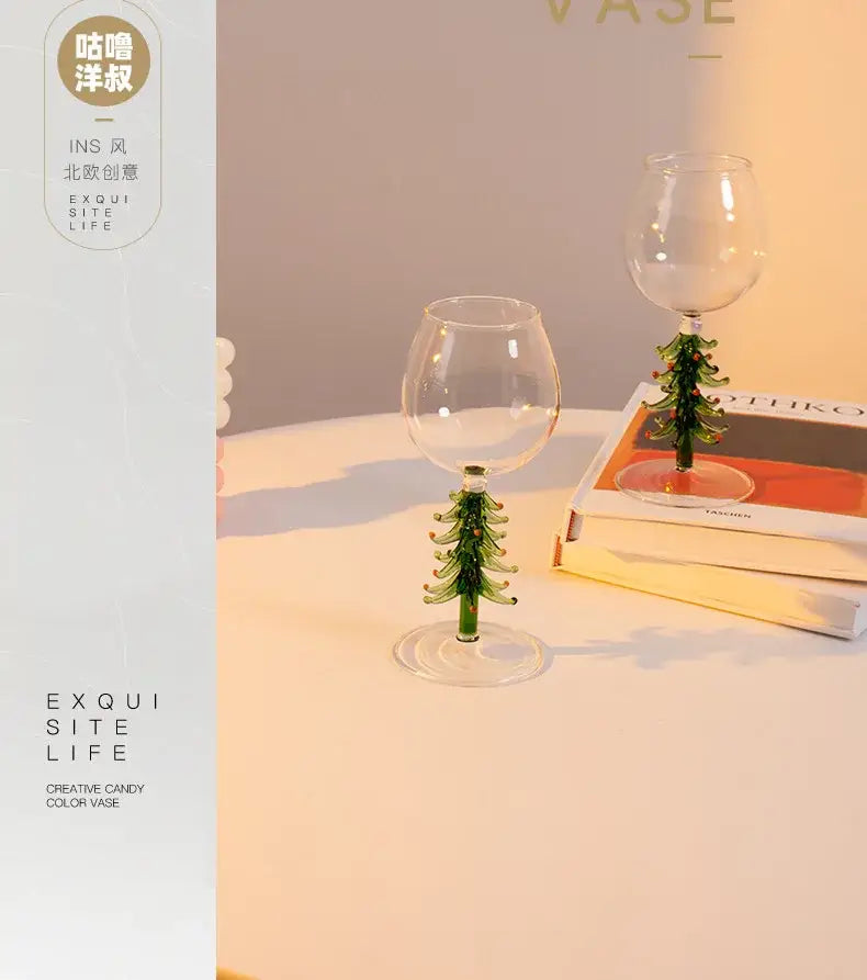 Clear glass christmas wine glasses with green tree-shaped stems from DecorBites™ festive colored wine glasses