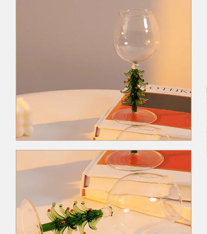 Clear glass wine glass with green hand-blown christmas tree stem and red berries for festive christmas wine use