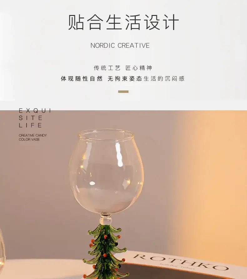 Clear glass wine goblet with green tree-shaped stem and orange accents from decorbites™ festive christmas wine glasses collection