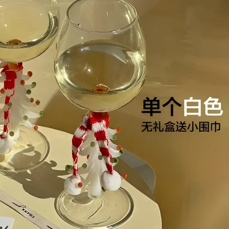 White christmas tree-themed wine glass ornament with red and white knitted scarf festive christmas wine glasses