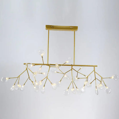 Gold-toned firefly led island pendant light with clear glass globe bulbs and branching metal frame for dining room ceiling