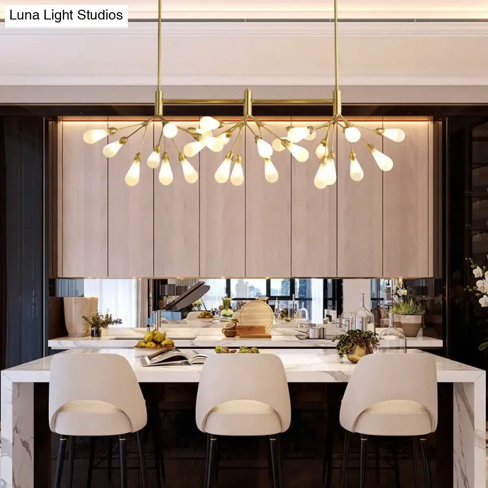 Gold-toned DecorBites™ Firefly suspension light with brass finish and 27 frosted glass globes in a tree-like design