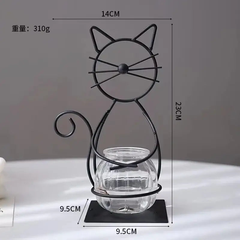 Black metal cat-shaped metal vase stand with clear glass jar featured in decorbites flamingo metal vase home decor