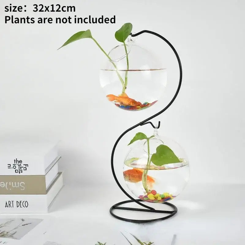 Decorbites™ flamingo metal vase features a black metal s-shaped stand holding two clear glass spherical fishbowls for home decor