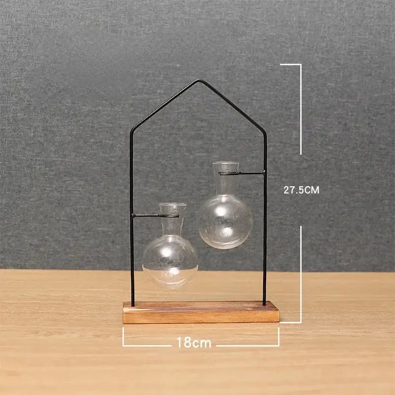 Decorbites™ flamingo metal vase features clear glass terrariums on a black metal frame and wooden base for home decor