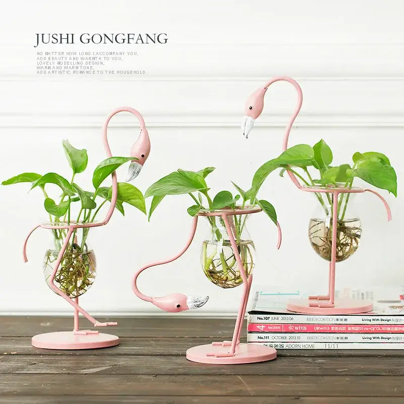 Decorbites™ flamingo metal vase home decor featuring pink metal flamingo planters with glass water bowls and green plants