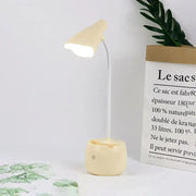 Cream-colored flexible-neck led desk lamp with rounded base and soft-glowing shade in white pink blue for reading