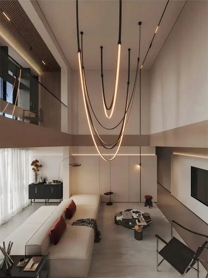 Modern minimalist DecorBites flexible leather belt led chandelier with sleek curved light strips in warm glow for living room