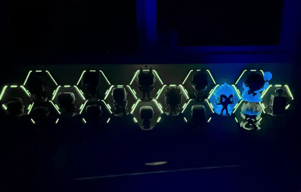 Decorbites™ floating display shelf with glowing hexagonal design and neon green and blue illuminated figurines