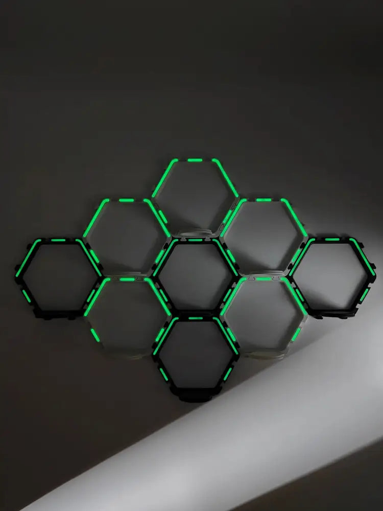 DecorBites™ floating display shelf featuring a modern hexagonal light fixture with glowing green led edges and black frames