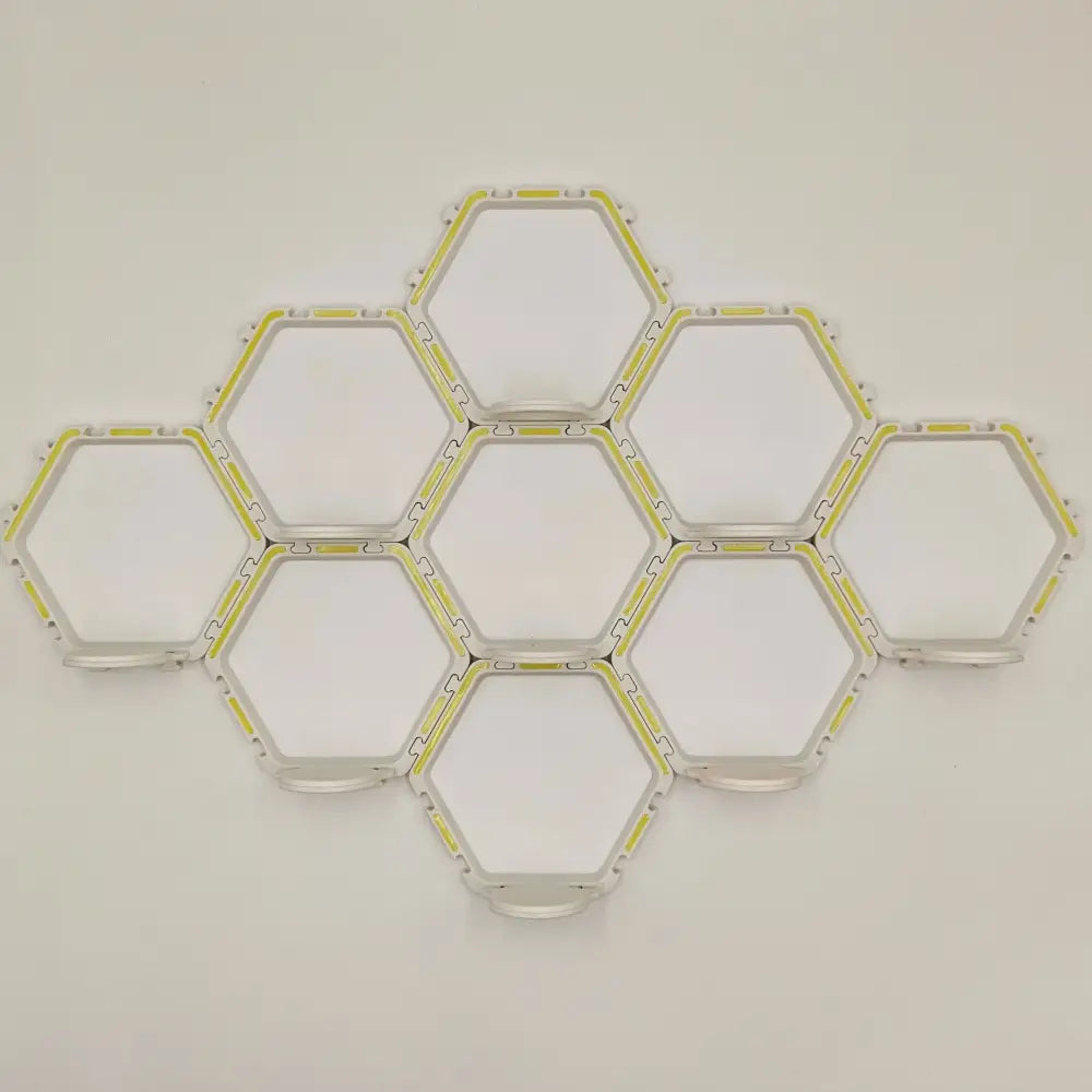 DecorBites™ floating display shelf featuring modular hexagonal led light panels with white frame and yellow accents