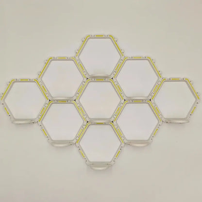 DecorBites™ floating display shelf featuring modular hexagonal led light panels with white frame and yellow accents
