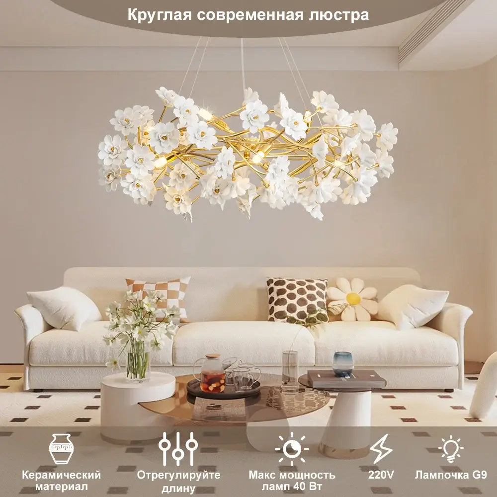 A modern DecorBites™ floral french white ceramic chandelier with delicate white flower chandelier on gold frame