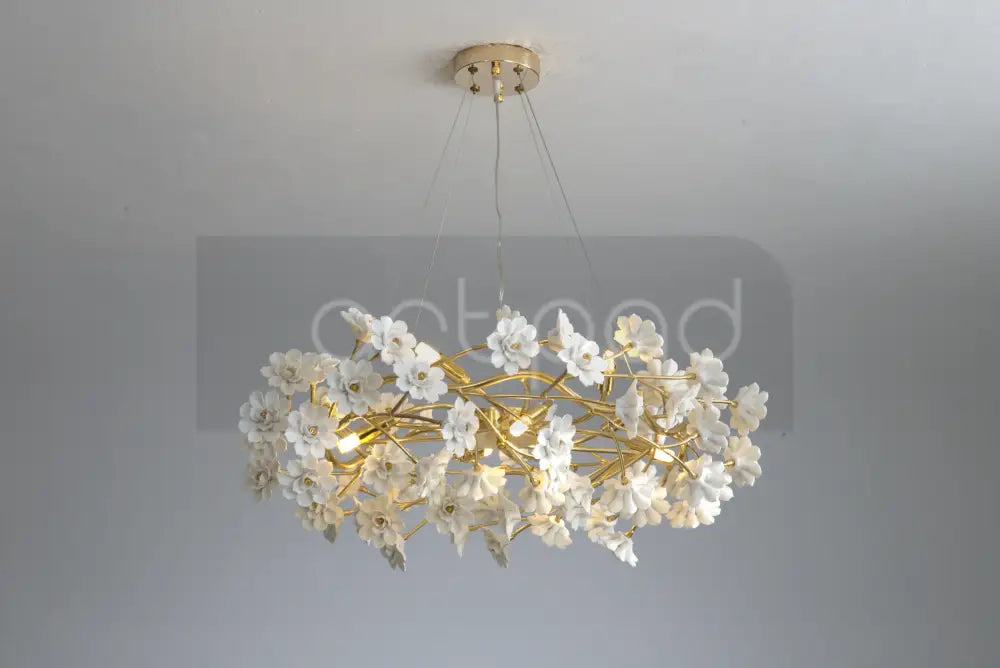 Decorbites™ floral french white ceramic chandelier featuring delicate white flower design and gold-toned metal branches