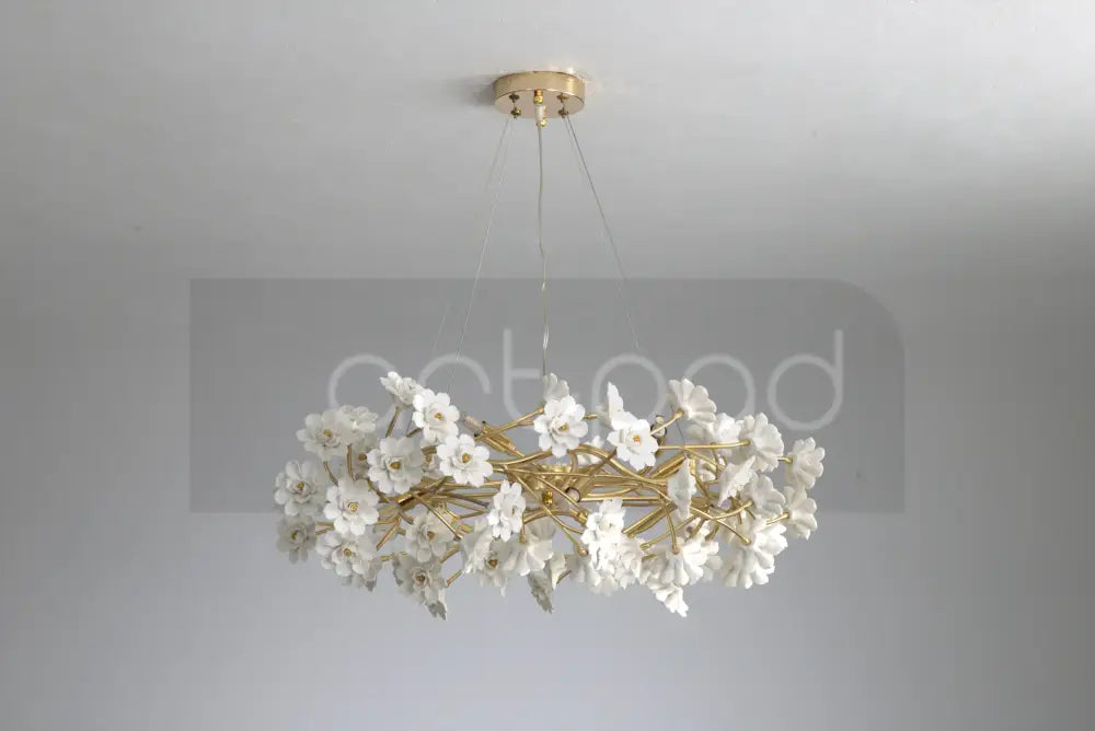 DecorBites™ floral french white ceramic chandelier with delicate white flower design and gold-toned metal frame