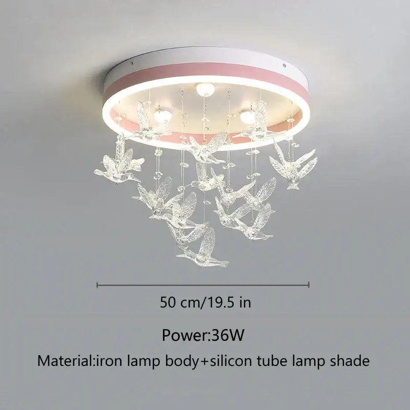 A decorbites flying bird ceiling light with white and pink frame and clear crystal bird ornaments for bedroom use