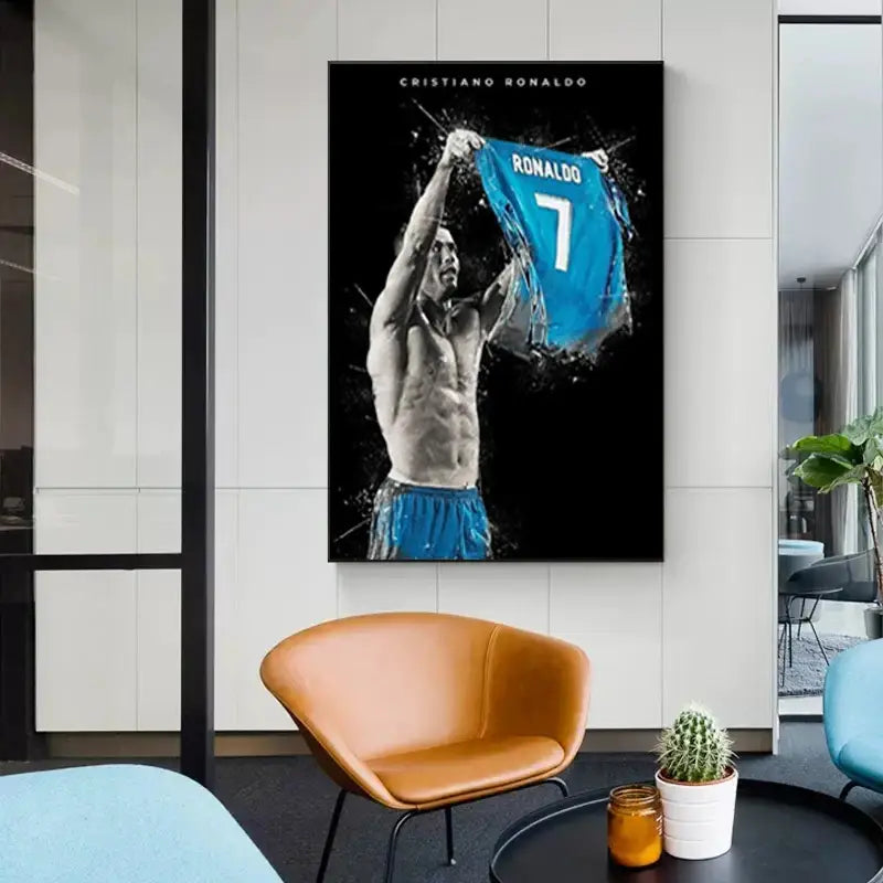 A framed black and white canvas print of football star cristiano ronaldo holding a blue number 7 jersey for home decor star posters