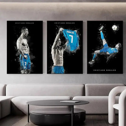 Three framed black and white football star posters of Cristiano Ronaldo in blue jersey displayed above a modern sofa