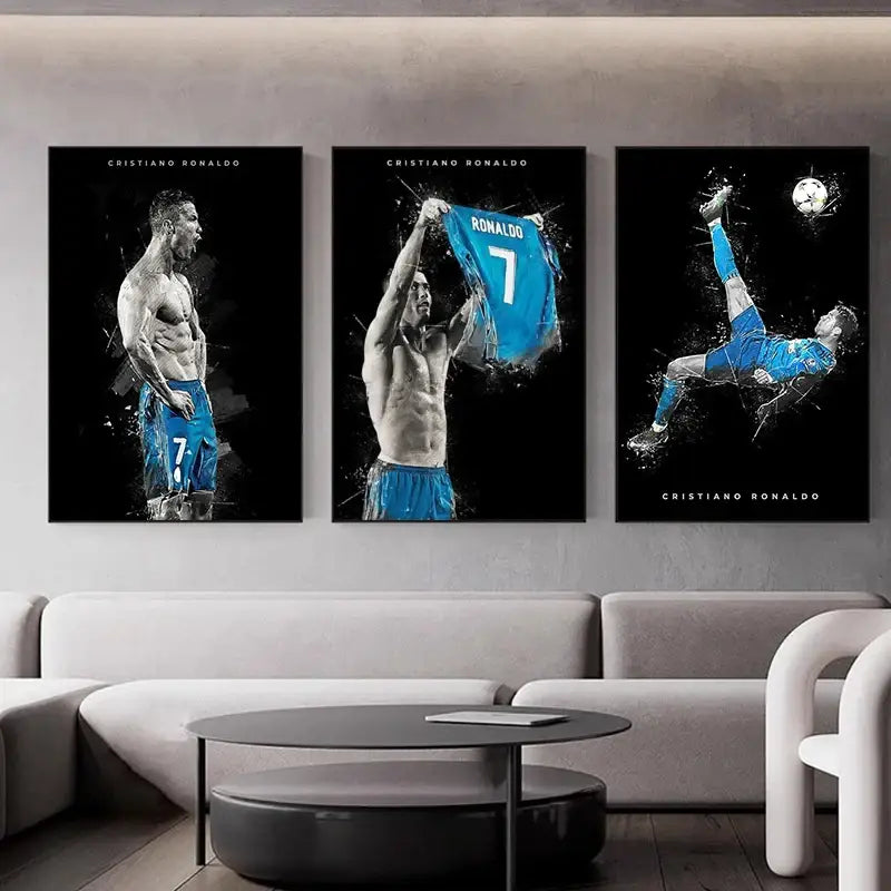 Three framed black and white football star posters of Cristiano Ronaldo in blue jersey displayed above a modern sofa