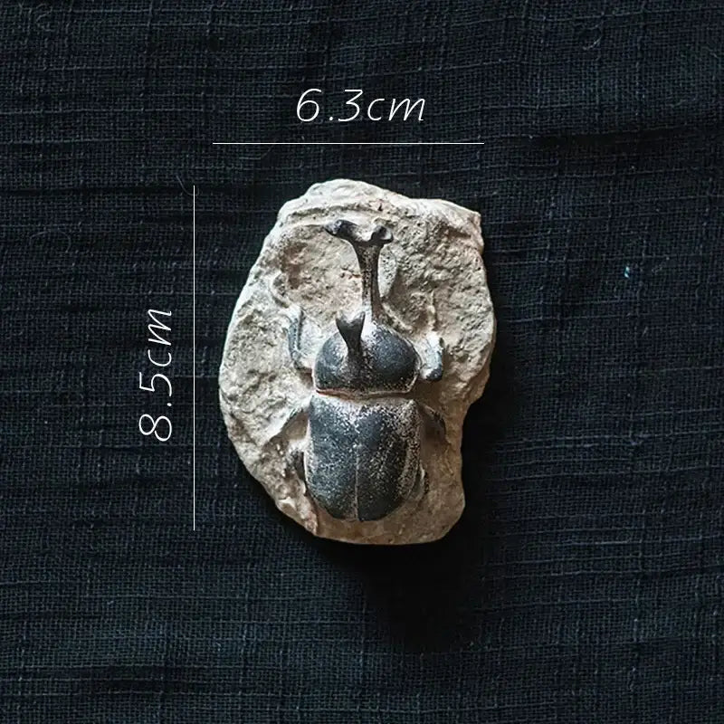 Decorbites fossil series art refrigerator sticker of a fossilized rhinoceros beetle in beige rock kitchen decor