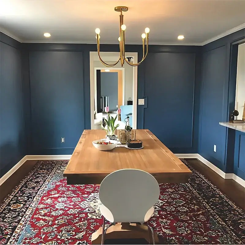 A modern gold-toned decorbites french candle led chandelier with multiple exposed bulbs for kitchen lighting