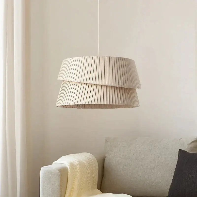 Beige pleated tiered pendant lamp with soft textured fabric finish from decorbites french cream chandelier collection