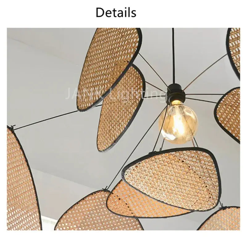 A decorbites™ french design rattan chandelier with oval woven rattan shades and black metal frames for home lighting