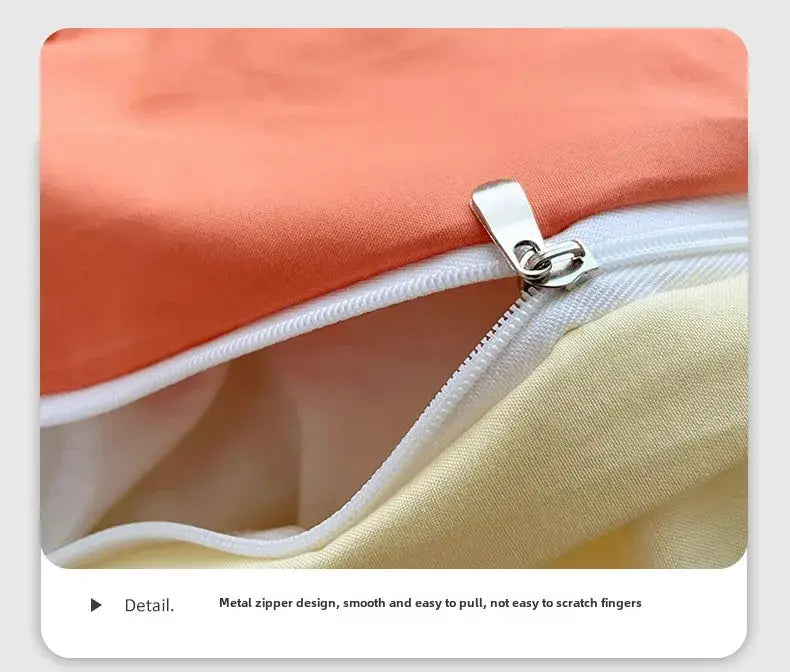 A sleek silver metal zipper on the fresh solid color cotton quilt set by decorbites with orange and cream fabric