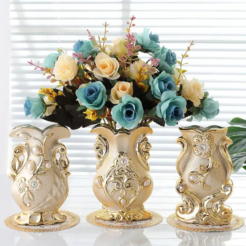 Three ornate gold-toned frosted porcelain flower vases with intricate floral designs for elegant home decor