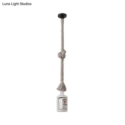 Frosted white glass jack daniel’s bottle pendant lamp with beige rope and black ceiling mount for loft style decor