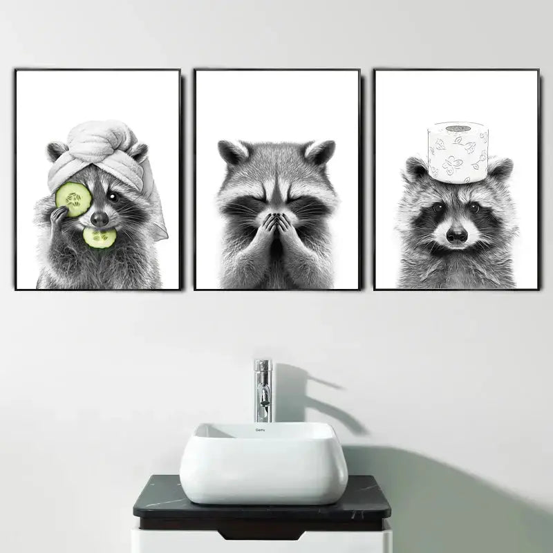 Set of three black and white framed raccoon wall art prints by DecorBites™ for bathroom decor with toilet paper theme