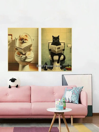Two framed vintage-style animal bathroom posters featuring a pomeranian and black cat on toilets above a pink sofa for home decor