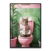 A framed DecorBites™ canvas wall art featuring a funny cat reading on a pink toilet with green tiled walls