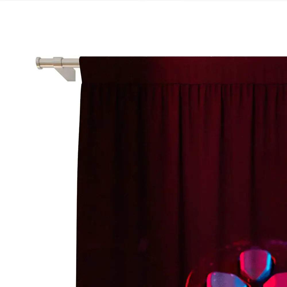 Deep red velvet decorbites game console handle curtains with smooth rich texture hanging from sleek silver rod