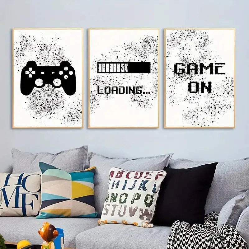 Set of three framed graffiti gamepad canvas prints with black splatter on white for gamer room decor by decorbites