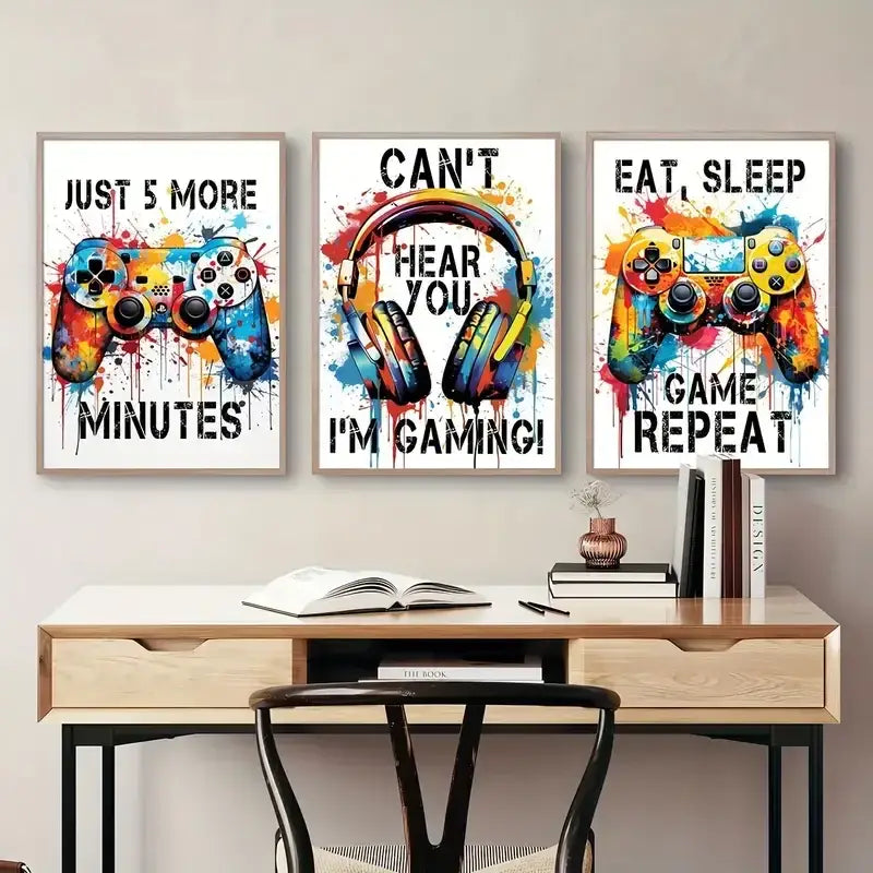 Three framed graffiti gamepad posters with vibrant paint splatter and bold text for gamer room decor by decorbites
