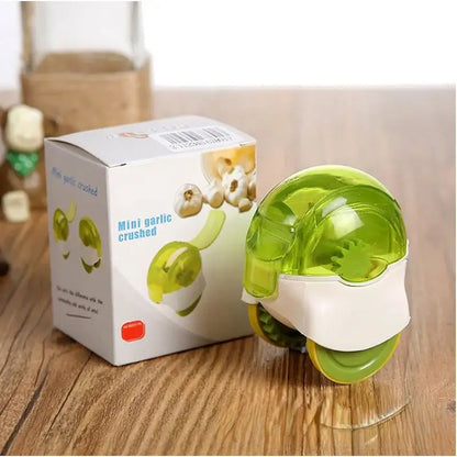 Transparent lime green and white plastic decorbites garlic chopper with rounded dome top for kitchen mincing tasks
