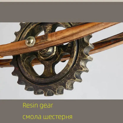 Antique-finish resin gear with brass-colored hub and wooden shafts in decorbites gear industrial chandelier pendant for dining room