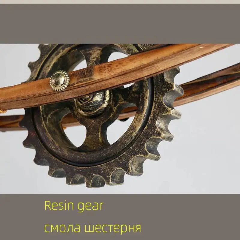 Antique-finish resin gear with brass-colored hub and wooden shafts in decorbites gear industrial chandelier pendant for dining room