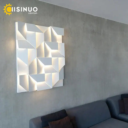 White geometric art indoor wall lamp with illuminated facets by decorbites for bedroom and living room decor