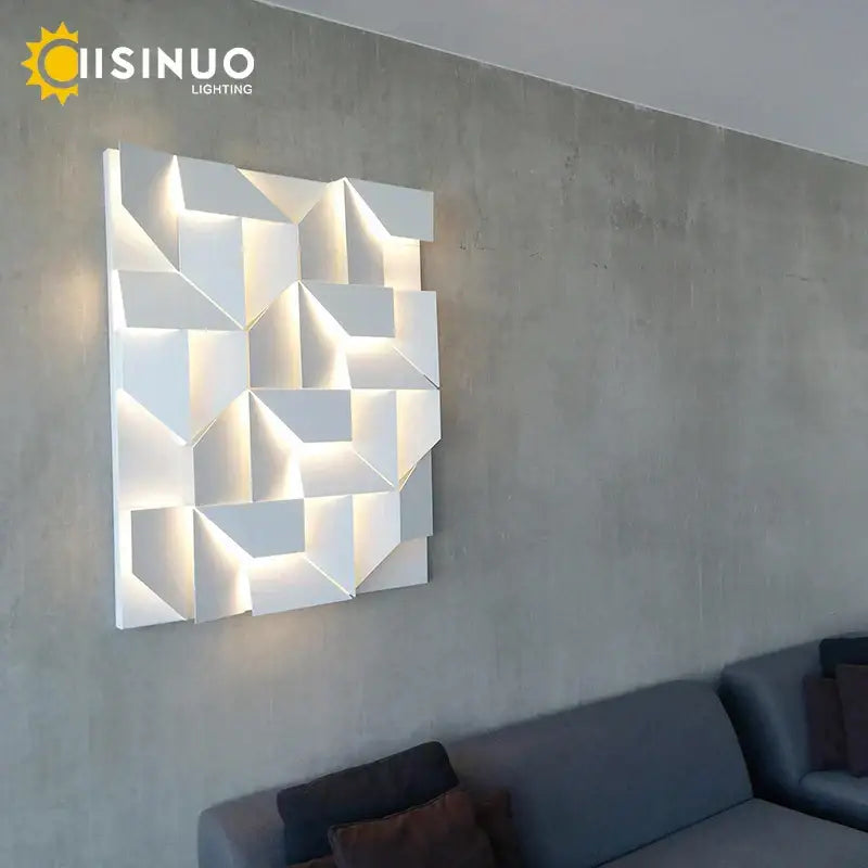 White geometric art indoor wall lamp with illuminated facets by decorbites for bedroom and living room decor
