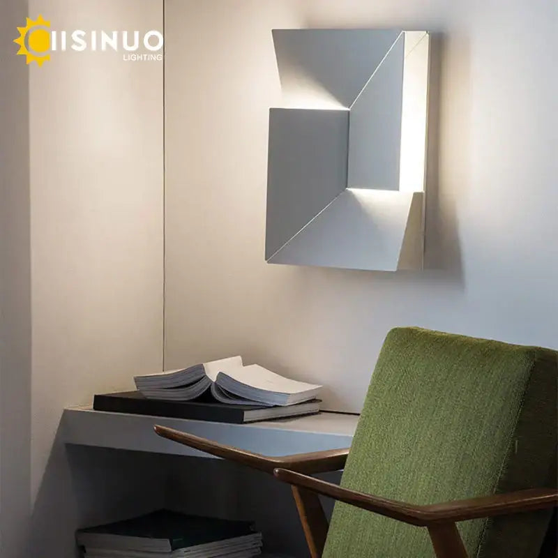 Modern geometric art indoor wall lamp by Decorbites with sleek silver metallic finish and angular faceted design