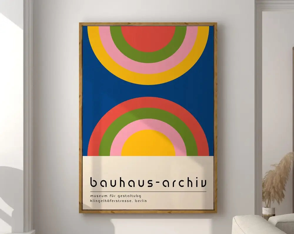 A framed canvas poster featuring bold concentric rainbow arcs in modernist bauhaus geometric style on deep blue background