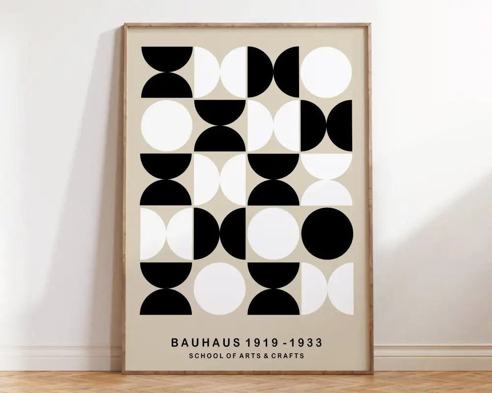 A minimalist decorbites™ geometric bauhaus canvas poster with black and white circles in a light wood frame