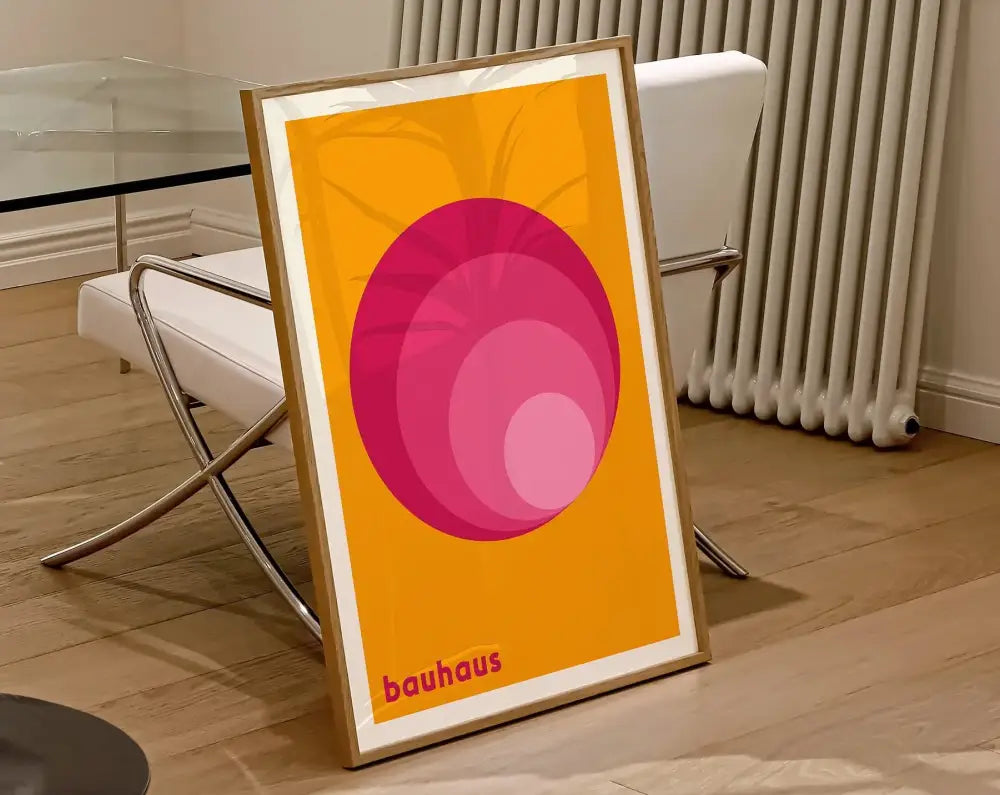 A framed DecorBites™ geometric bauhaus canvas poster with concentric pink circles on vibrant orange background