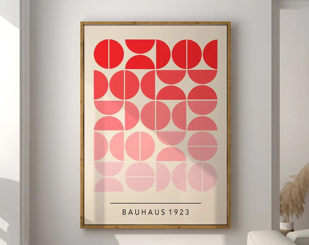 A framed decorbites™ geometric bauhaus canvas poster featuring red and pink circular shapes on an off-white background
