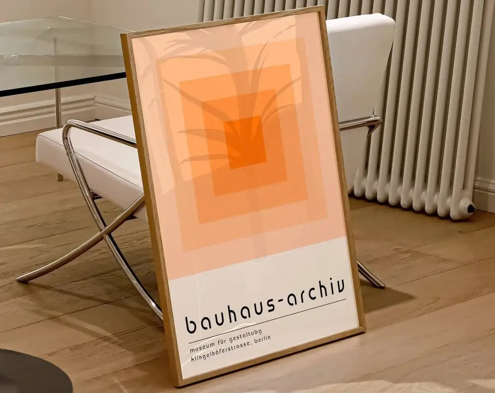 Minimalist geometric bauhaus canvas poster with concentric orange squares and palm leaf silhouette by decorbites