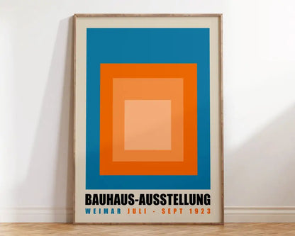 Framed DecorBites™ geometric bauhaus canvas poster with blue orange and peach concentric squares and bold black text