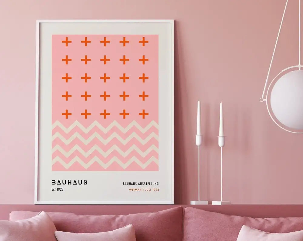 A framed decorbites™ geometric bauhaus canvas poster with pink background and orange plus signs above white zigzag pattern