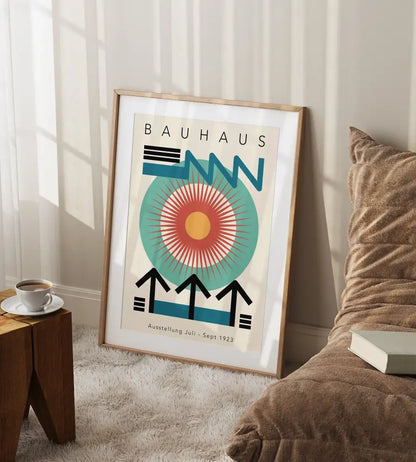 A framed geometric bauhaus canvas print featuring bold blue teal and orange on an off-white background for home decor